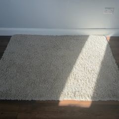 Cream shaggy rug