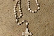 handmade wooden rosary from Medjugorje featuring a cross with the town's name engraved on it. New never used