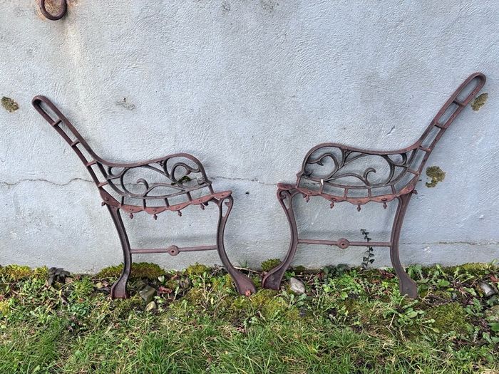 Pair cast iron children's bench ends