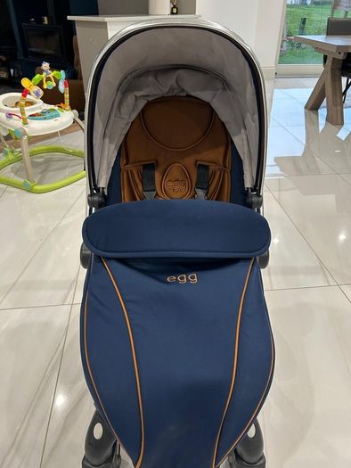 Navy egg carrycot and also Converts to a tandem pushchair
