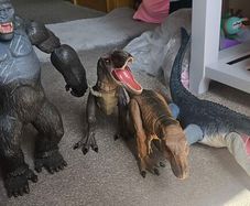 4 large dinosaur and King Kong figures