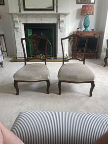 Pair Edwardian period carved mahogany low nursing chairs