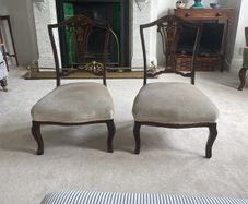 Pair Edwardian period carved mahogany low nursing chairs
