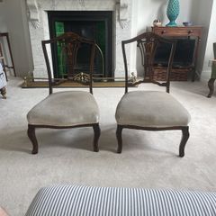 Pair Edwardian period carved mahogany low nursing chairs