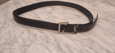 Black leather belt in the style of designer