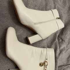Women's white heeled boots with gold design