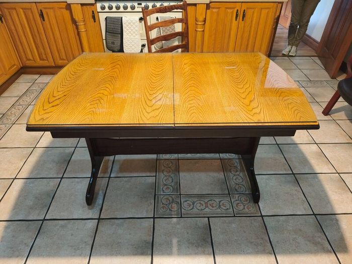 Dining table with glass top and four chairs
