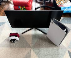 PS5 with 2 controllers and 34 gaming monitor