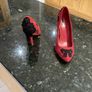 Red high heeled shoes with black lace Image 3