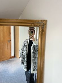 Reversible knitted piece cardigan, a structured jacket, or a coat. Very warm.
