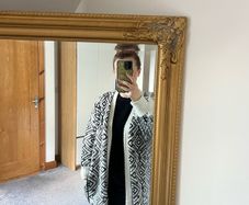Reversible knitted piece cardigan, a structured jacket, or a coat. Very warm.