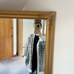 Reversible knitted piece cardigan, a structured jacket, or a coat. Very warm.