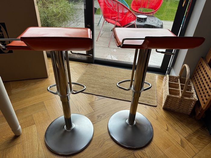 Vintage Italian orange leather bar stools.