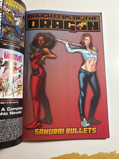 Marvel's Daughters Of The Dragon (2006) collecting Daughters Of The Dragon #1-6 by writers Justin Gray and Jimmy Palmiotti, and artist Khari Evans.