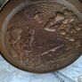 Large Brass Wall Charger Old World Pub Scene, Embossed Tavern scene of 17th-century Pubs. This is a striking brass wall hanging, with an Old World pub scene. It is pressed hammered brass. The raised relief image features a pair of men in Old World dress,  Image 4