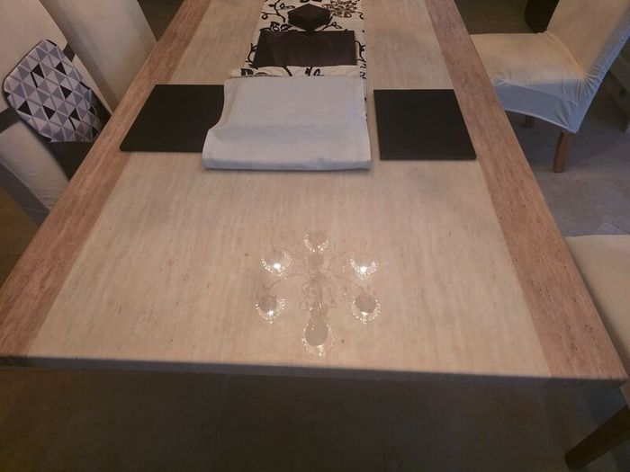 Marble table with 4 cream leather chairs