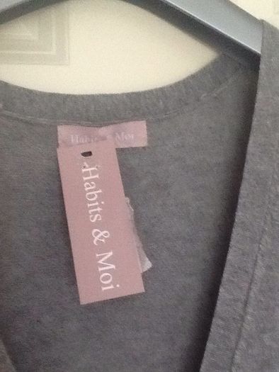 Sleeveless cardi with two patch pockets. Bought at carriage Donna.