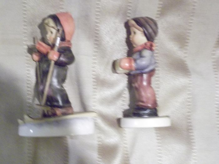 2 hummel figurines real hummel but are signed  ski heil skiar and for me