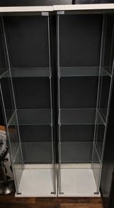 Two Detolf Ikea glass display cabinets