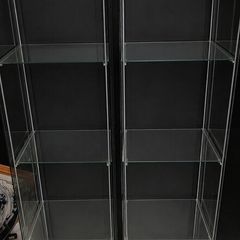 Two Detolf Ikea glass display cabinets