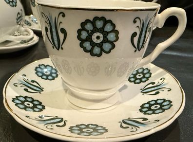 Mayfair Bone China 4 Cups & 5 Saucers and jug.