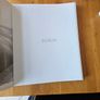 FAMILY. Hardcover VERY LARGE VOLUME edition of the photography book "Family: A Celebration of Humanity" featuring a foreword by James McBride. [1, 2]  This book contains 100 photographs chosen from thousands submitted by photographers from 164 countries. Image 3