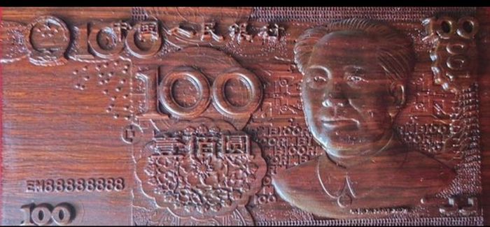 Carved wooden banknote. 100 yuan.