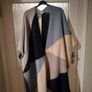 Monsoon Colourblock Knit Poncho. The design features an abstract, geometric color-block pattern with shades of blue, grey, and cream and Navy. Image 4