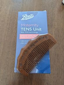 TENS machine and birthing comb