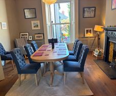 Neptune solid oak extendable dining table with 8 upholstered dining chairs. RRP 5,000 euro