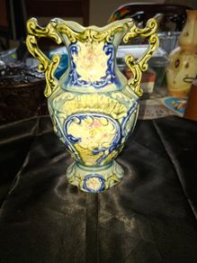 Antique Majolica Vase featuring ornate double handles, Postage Available