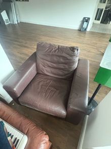 2 brown arm chairs