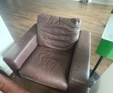2 brown arm chairs