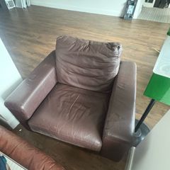 2 brown arm chairs