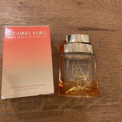 Empty perfume bottle signed by Michael Kors & Gigi Hamid