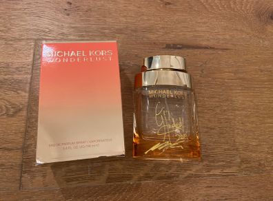 Empty perfume bottle signed by Michael Kors & Gigi Hamid