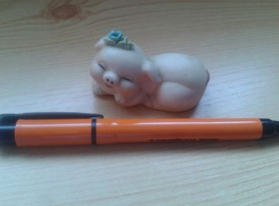 Sleepy little pig ornament