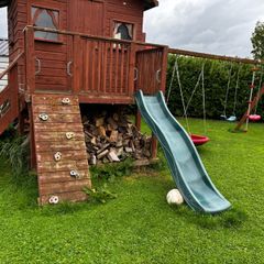 Playhouse with swings and slide