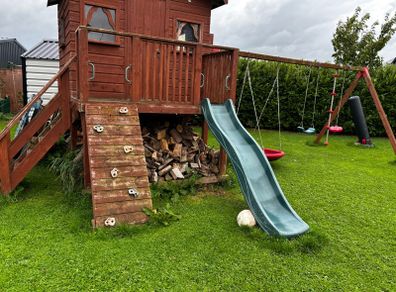 Playhouse with swings and slide