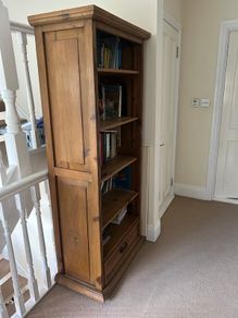 Solid wood bookshelf with bottom drawer