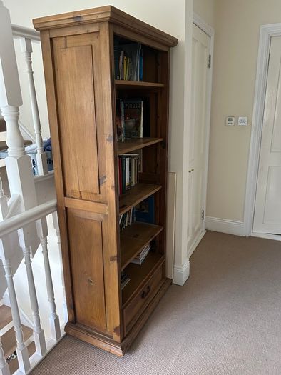 Solid wood bookshelf with bottom drawer