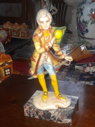 A Pair of Italian Depose Figurines The figurines depicts a 18th century Rococo style attire