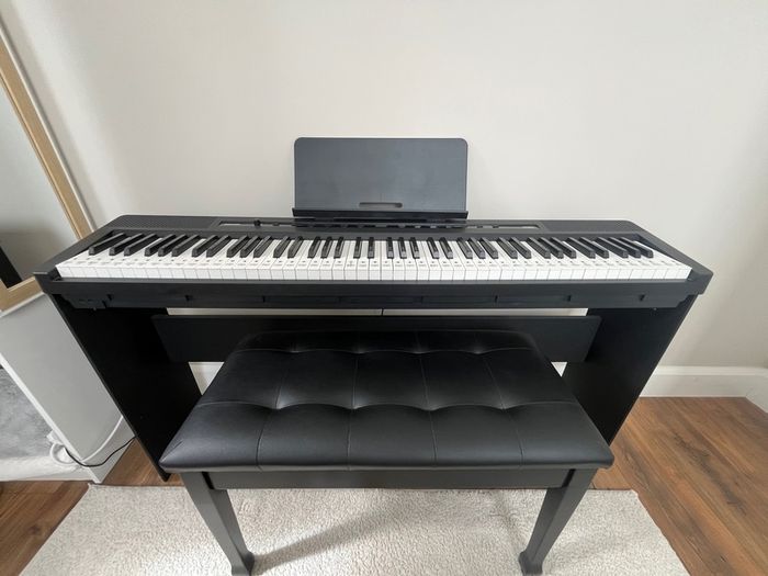 piano, bench and audio transmitter