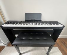 piano, bench and audio transmitter