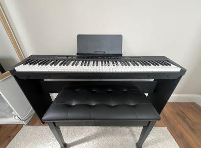 piano, bench and audio transmitter