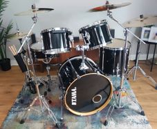 Tama 5-piece black Drum Kit with Zildjian cymbals and drum cases.
