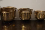 Antique graduated set of brass planters