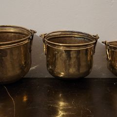 Antique graduated set of brass planters