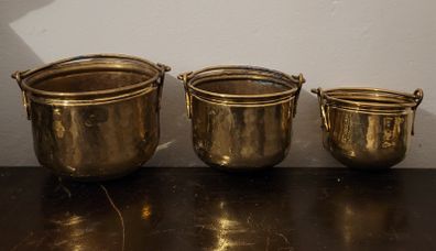 Antique graduated set of brass planters
