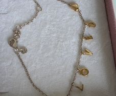 Pandora chain bracelet with gold yellow plated hearts, and dangle letters spelling LOVE adjustable closure with three length options: 16 cm, 18 cm, and 20 cm. In good condition few signs of wear.